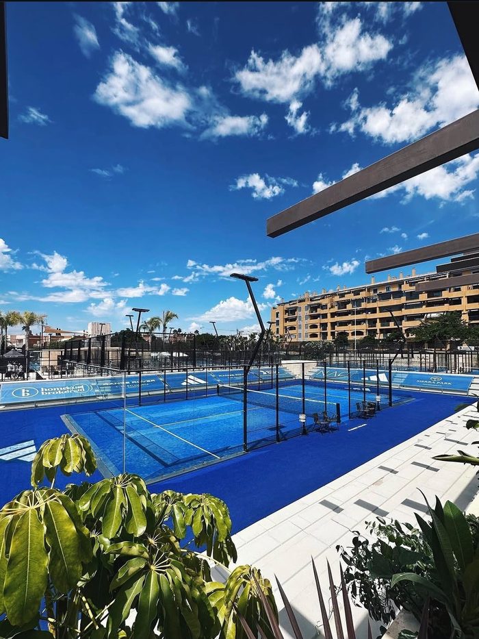 The club's padel court under clear skies in Marbella